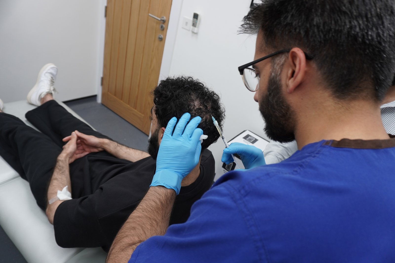 Clinician administering a PRP injection to a patient’s scalp at Sadiqi Medical Centre